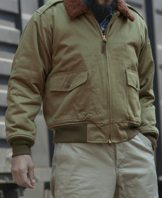 Khaki green flight jacket with brown shearling collar and zip front
