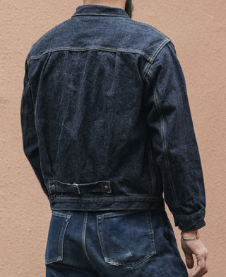 Back of indigo denim jacket with yoke seam and lower patch pocket details