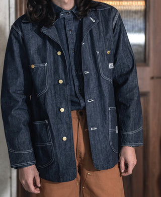Indigo denim jacket with button-front, chest pockets, and contrast stitch details