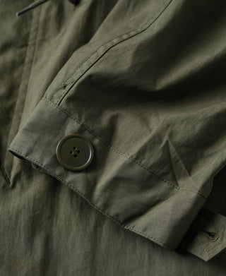 Olive M-65 parka sleeve cuff with round button closure