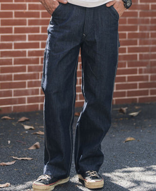 Indigo denim painter pants with wide straight legs and side seam stitching