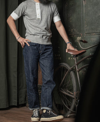 Men's dark denim jeans with five-pocket design and belt loops, straight fit