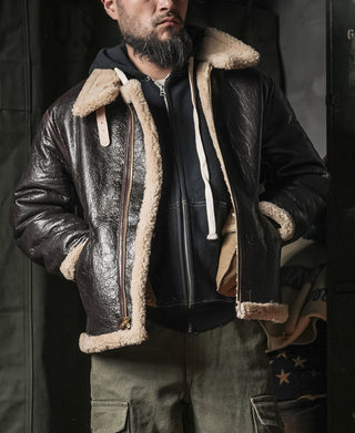 Dark brown leather flight jacket with cream shearling collar and zip front
