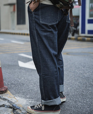 Indigo denim fatigue pants with back pocket and stitched hem