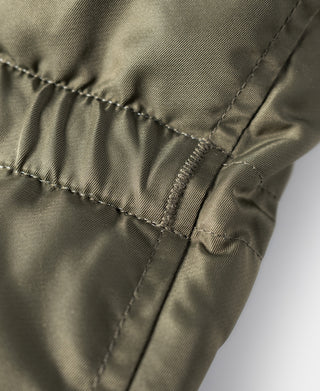 Olive parka hem drawcord toggle with stitched seam