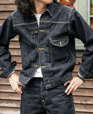 Selvedge denim cowboy jacket in indigo with chest flap pocket and hand-warmer pockets