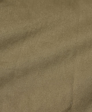 Khaki green M-42 paratrooper jacket fabric close-up with fine twill texture