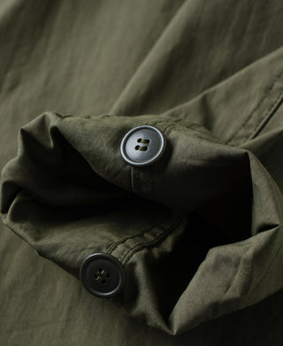 Olive M-65 parka with flap pocket and two-button closure