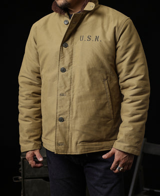 Khaki deck jacket front view with brown sherpa collar, U.S.N. chest detail