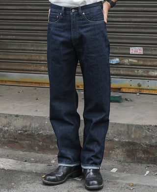 Indigo selvedge denim jeans with button fly and straight leg, dark wash