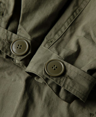 Olive M-65 parka pocket flap with two-tone round buttons