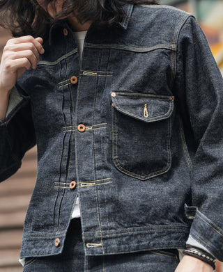 Selvedge denim cowboy jacket in indigo, close-up of button front and chest flap pocket