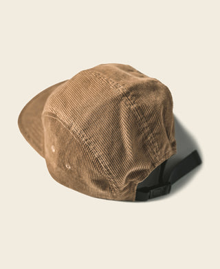 Khaki corduroy 5-panel cap with curved brim and dark inner band