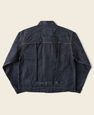 Indigo denim jacket back with yoke and buttoned pockets