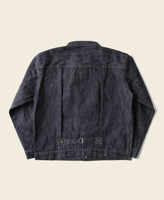 Indigo denim jacket back view with yoke panel and center seam, buttoned hem