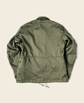 Olive field jacket back view with snap placket and waist adjustment