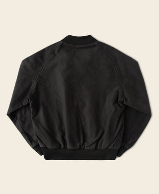 Black moleskin raglan bomber jacket back view with ribbed hem and relaxed shoulders