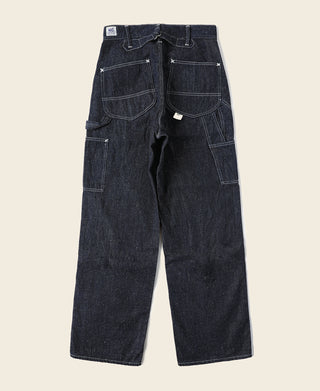 Indigo denim carpenter pants, back view with two large patch pockets and belt loops