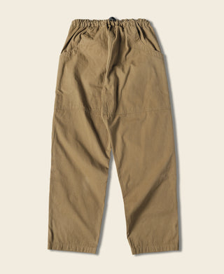 Khaki cotton canvas climbing pants shown from the back with elastic waist