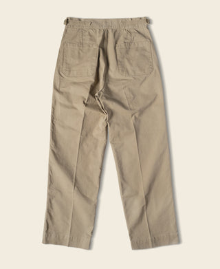 Khaki combat pants with pleated front and side pockets, relaxed fit