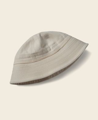 White dixie cup hat with short brim and stitched panel detail