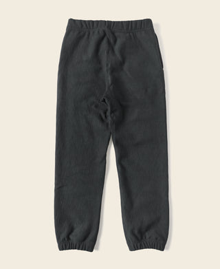 Black terry sweatpants, back view, elastic waistband and ankle cuffs