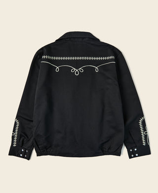Black musician jacket back view with embroidered vine trim across yoke and cuffs