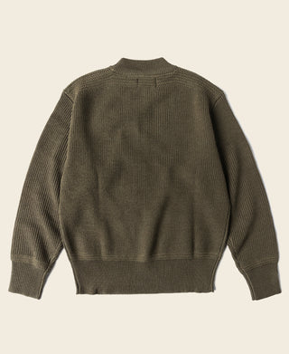 Olive crewneck wool sweater, ribbed hem and cuffs, shown from the back.