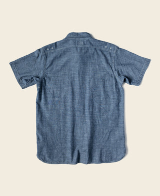Blue chambray work shirt, short-sleeve button-up with back yoke and stitched darts.