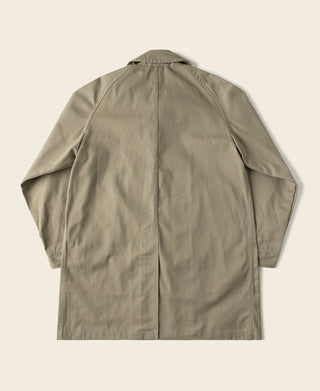 Khaki all-weather trench coat back view with center seam and yoke