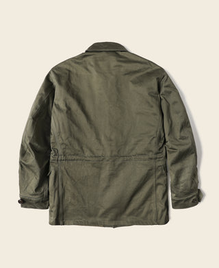 Olive M-1943 field jacket back view with central seam and button waist