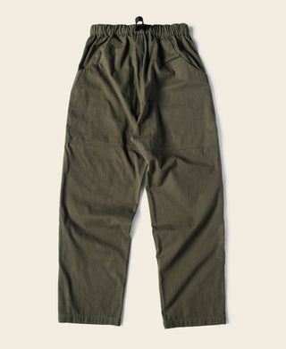 Olive cotton canvas climbing pants, full front view with elastic waist