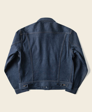 Indigo denim jacket with back yoke seam, buttoned cuffs, and long sleeves.