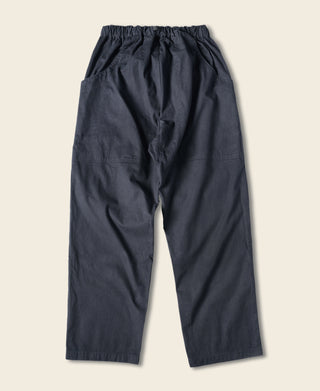 Navy cotton canvas climbing pants, back view, elastic waistband and cargo pockets