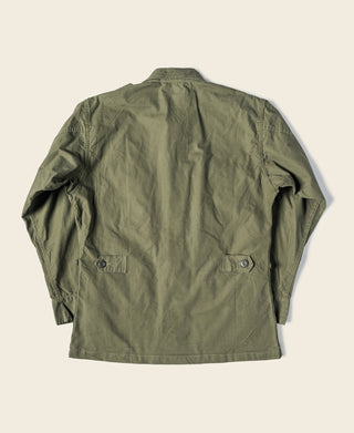Olive fatigue jacket, back view with stitched yoke and shoulder flap details
