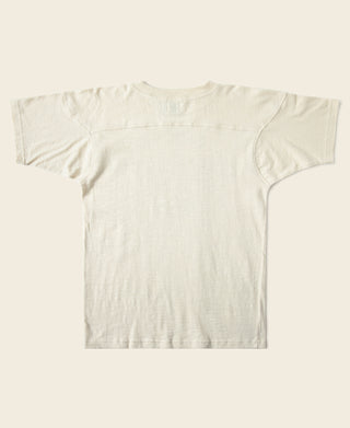 Cream football T-shirt with navy back graphic and number 99