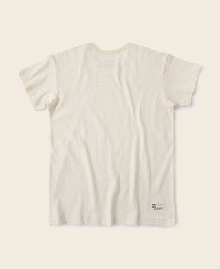 Light apricot crew-neck slub cotton T-shirt, back view with small hem tag