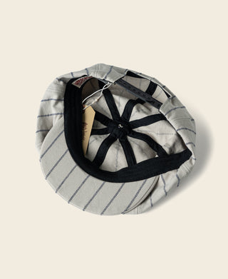 Gray railroad stripe newsboy cap with black bow detail and striped panels