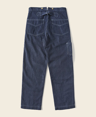 Indigo pinstripe work pants with pleated front and adjustable waist buttons