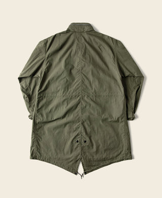 Olive M-65 style parka with stand collar and front zip; utility-style flap pockets