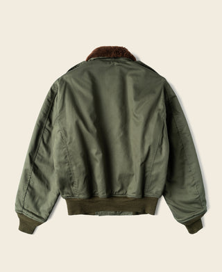Olive flight jacket back view with brown collar lining and ribbed hem cuffs