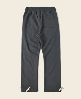 Black terry sweatpants, back view with drawstring waist and patch back pocket