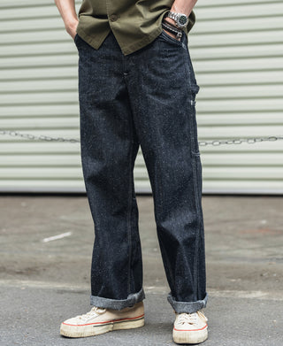 Indigo denim carpenter pants with cuffed hems and side cargo pocket detail