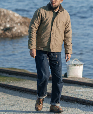 Khaki deck jacket on model with zip front and side pockets