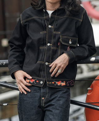 Black tour jacket with chest pocket, dragon embroidery patch, and snap button placket