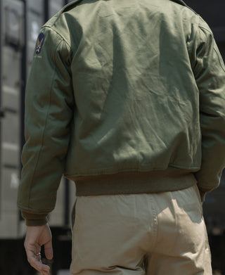 USAAF Type B-10 flight jacket in olive, back view with panel seams and rib cuffs