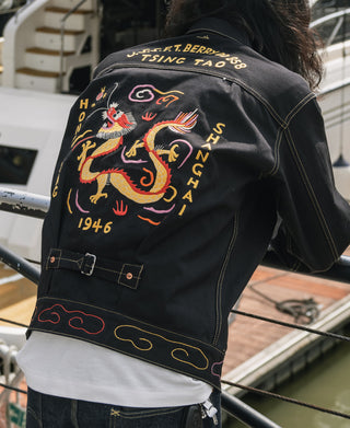 Black tour jacket with large dragon back embroidery and multicolor trim hem