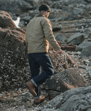 Khaki deck jacket on model from behind, fur-lined collar