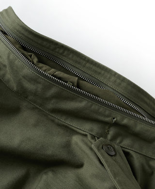 Olive field jacket zipper and welt seam detail on front