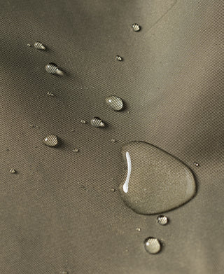 Water-repellent olive parka fabric with visible water droplets